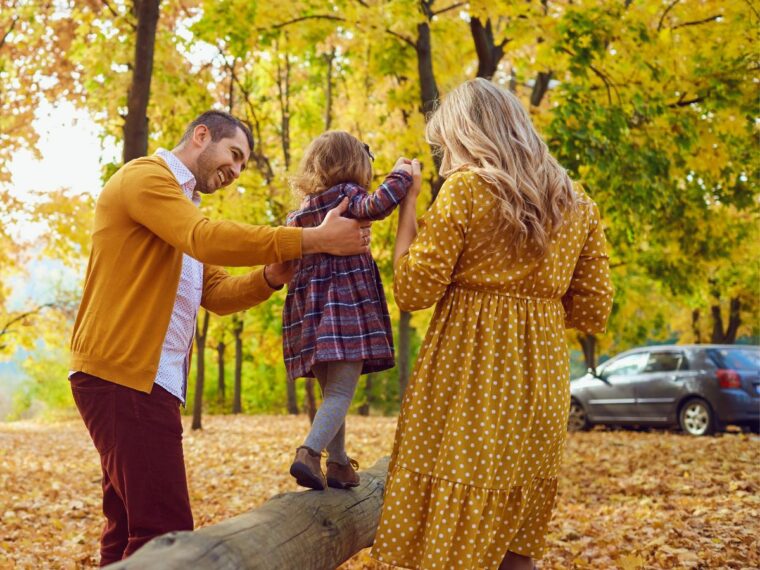 Family taking photos in the fall in the same color palette