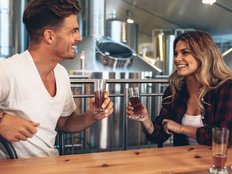 Two people drinking at a brewery