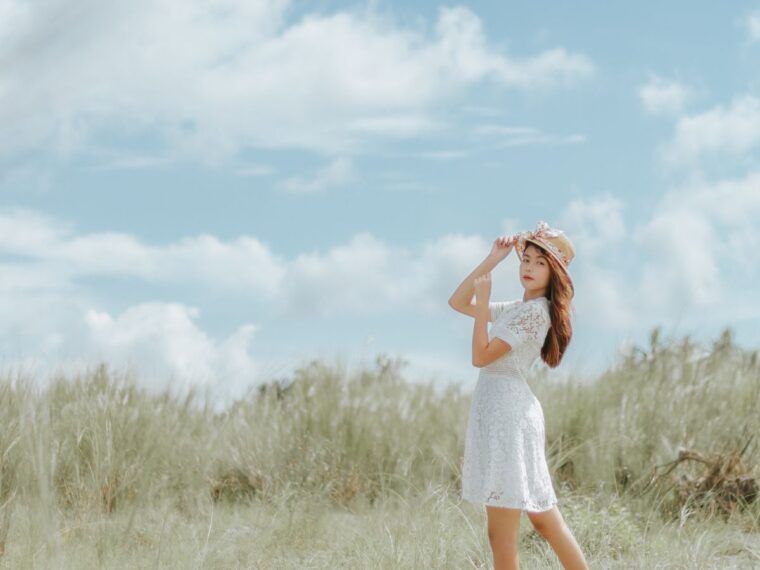 A girl in a white dress in a field