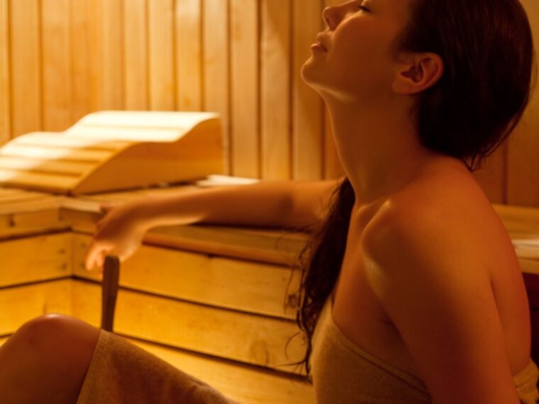 A woman relaxed in a sauna