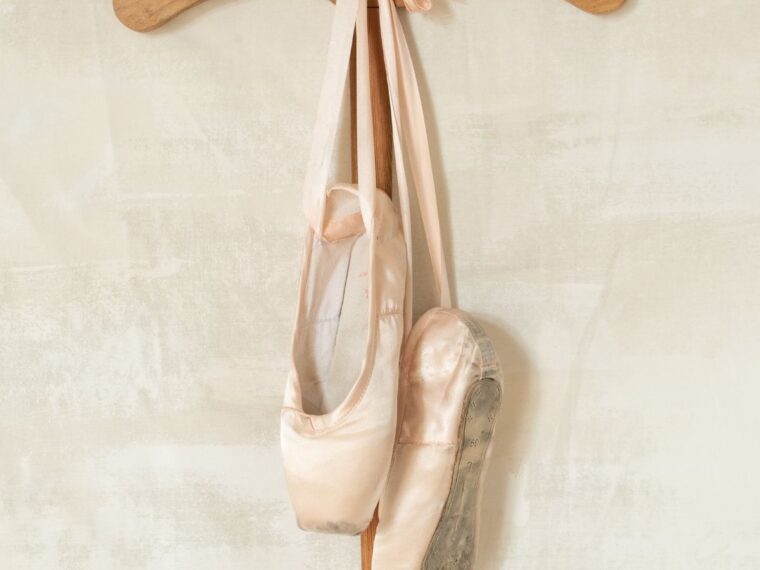 Ballet shoes hanging on a wall