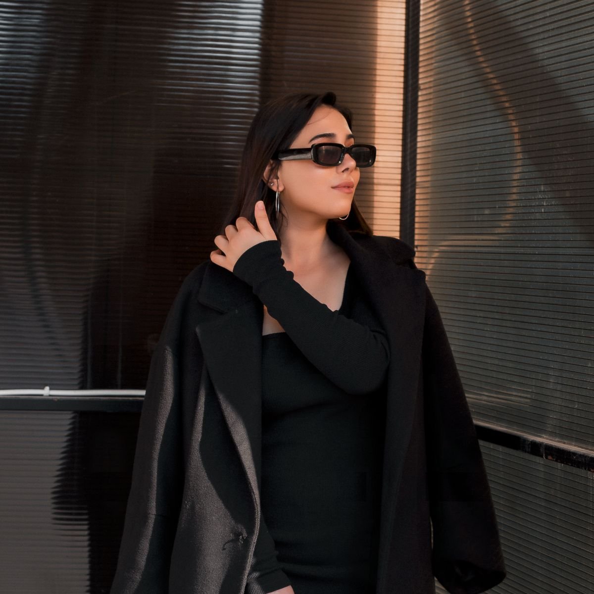 A girl in an all black outfit