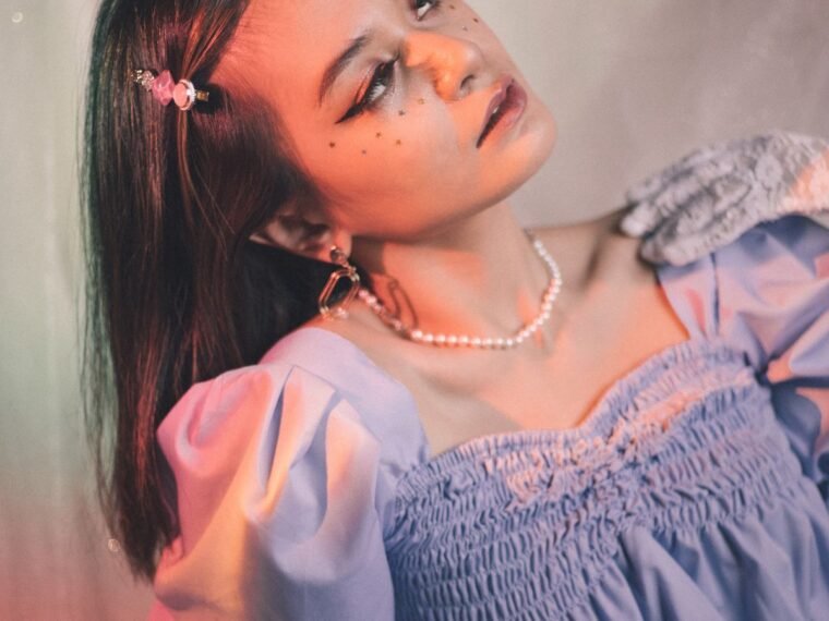 A girl in a purple ruffle top