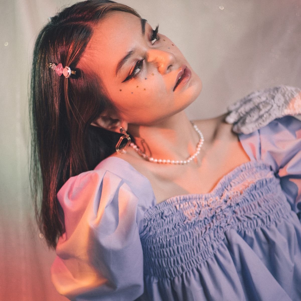 A girl in a purple ruffle top