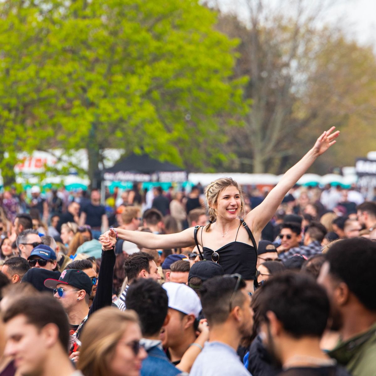A girl having fun in a crowd at a concert