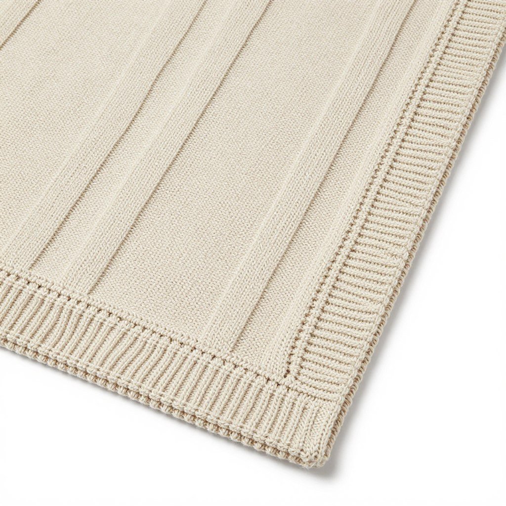 Baby blanket coordinating with sweater color