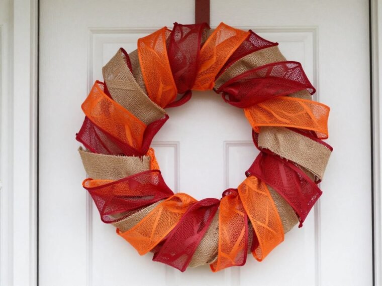 Beautiful completed DIY deco mesh wreath hanging on front door