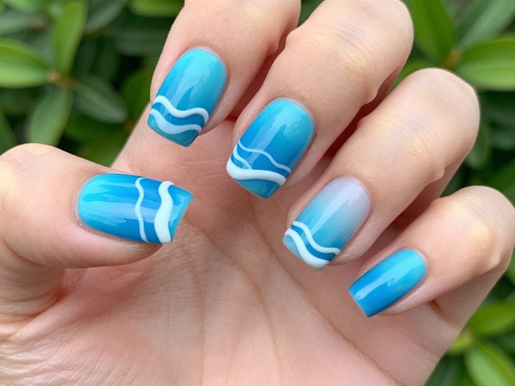 Electric blue wave pattern nail design