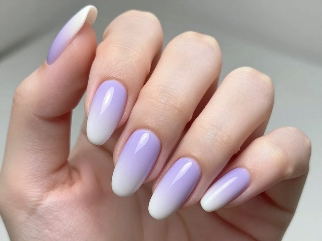 Lavender gradient nail design fading from deep purple to white