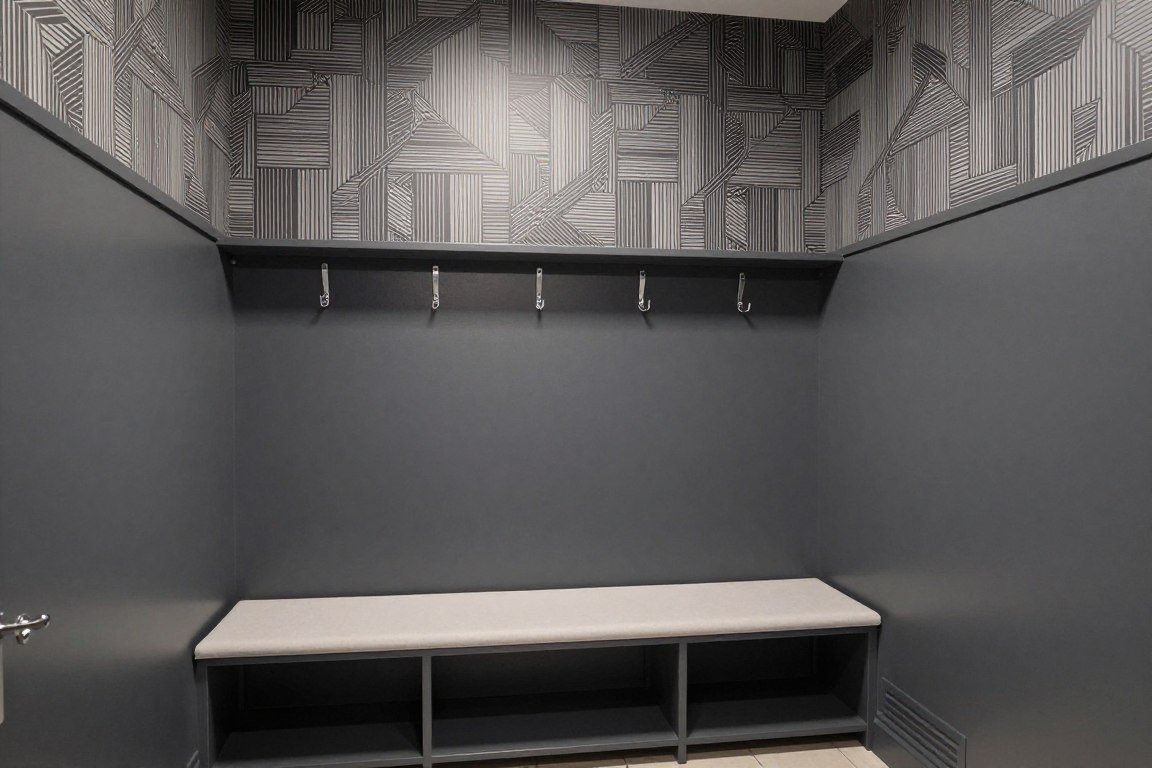 Modern mudroom with geometric wallpaper and charcoal paint