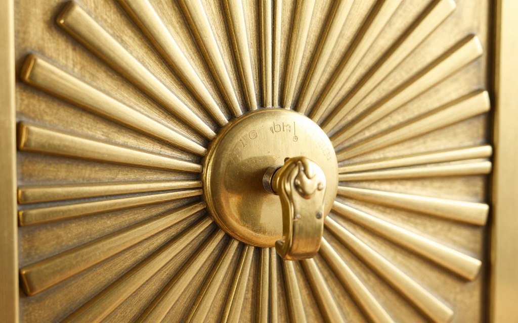 Ornate brass cabinet hardware with Art Deco geometric design
