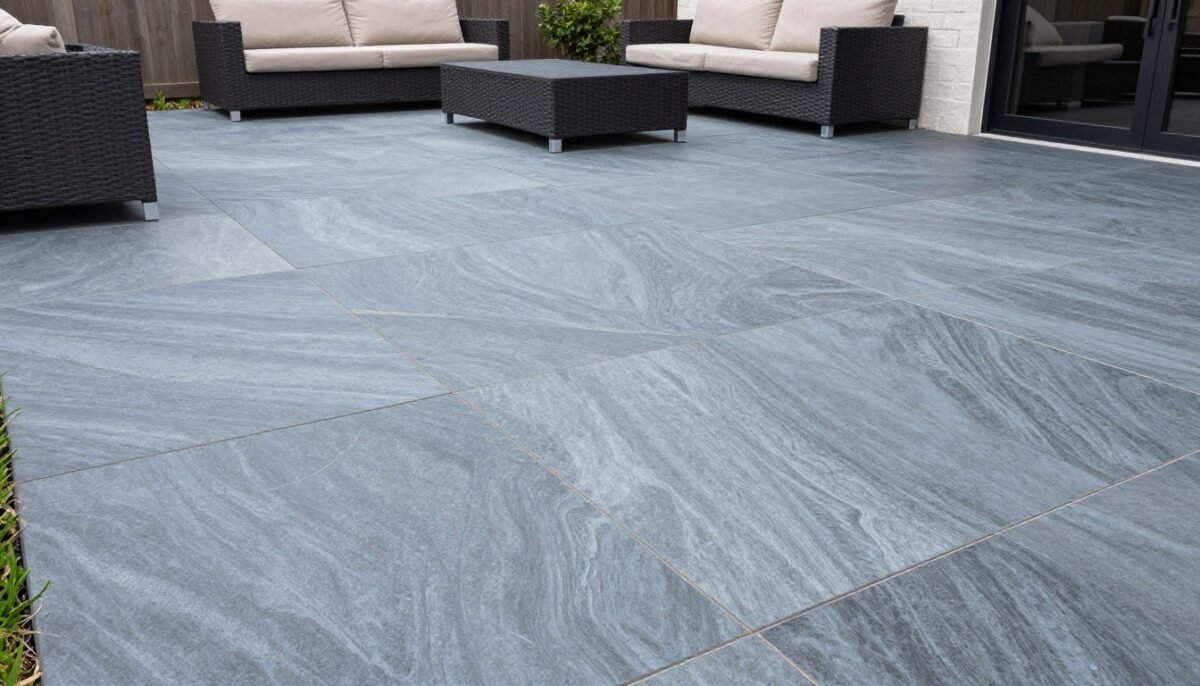 Smooth slate textured concrete patio with subtle surface variation in blue-gray tones