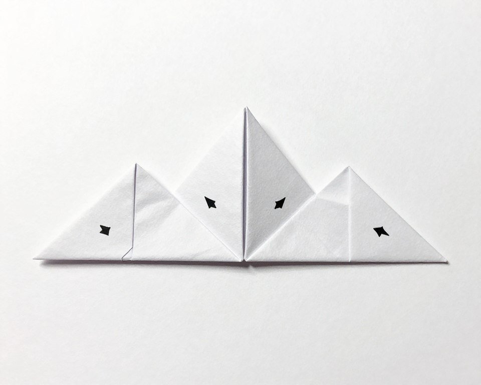 Step-by-step diagram showing how to create a mountain fold