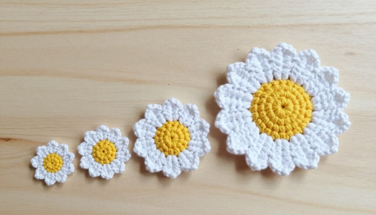 Various daisy crochet flowers in different sizes showing size variation
