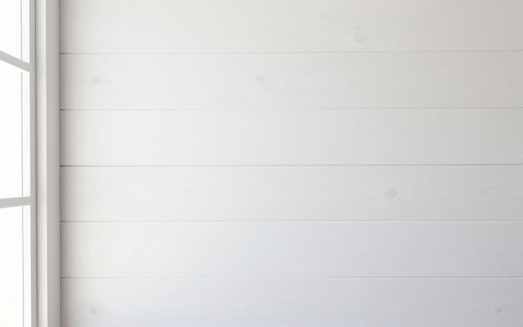 White shiplap wall planks in modern farmhouse interior