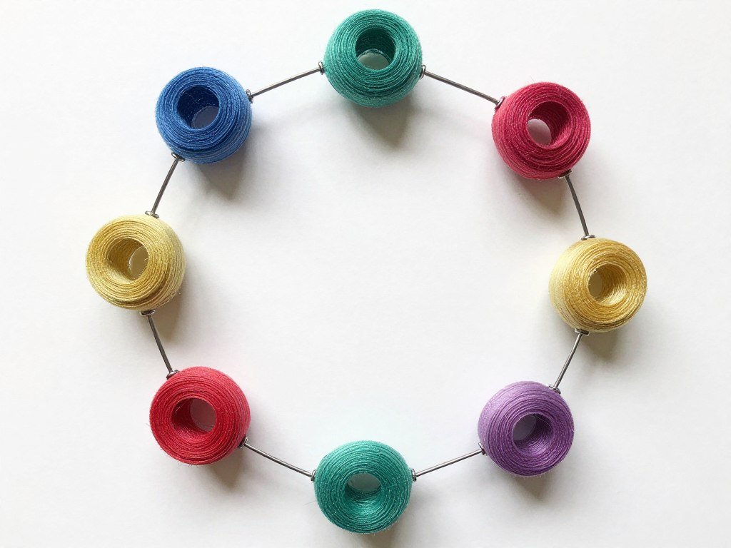 Wire wreath form with several curls attached showing spacing