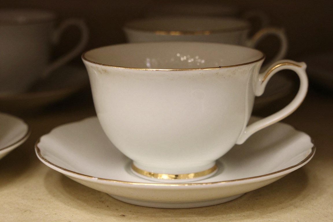 dusty tea cup showing accumulation on open display
