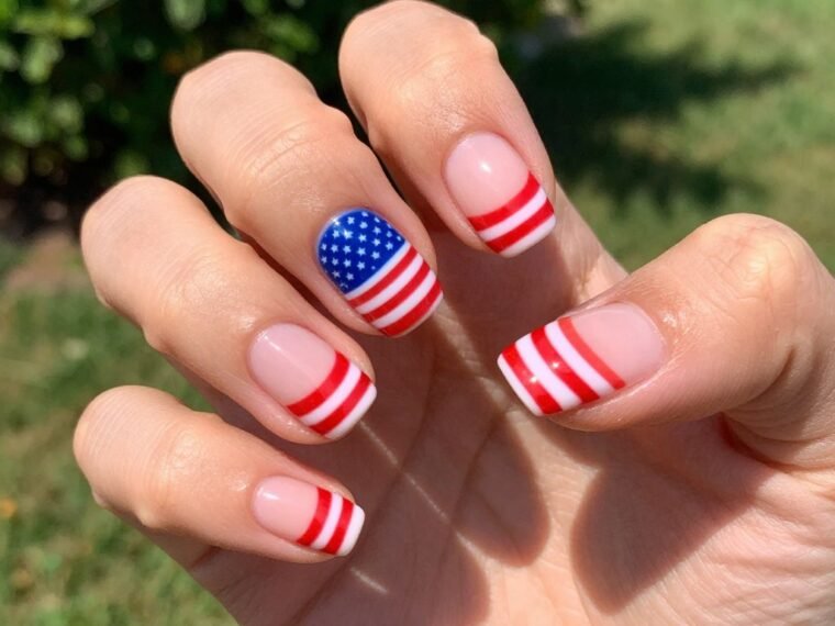 4th of July gel nail designs featuring full American flag accent nail with stars and stripes