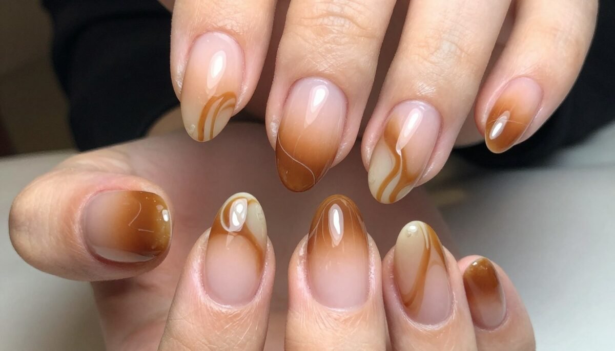 Caramel swirl French tips with blended light and dark tones for autumn