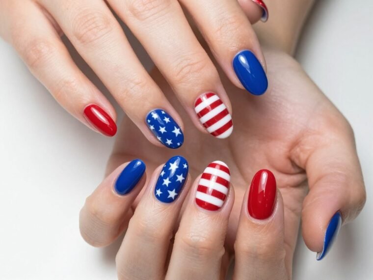 Elegant 4th of July nail art featuring red white and blue design with stars and stripes