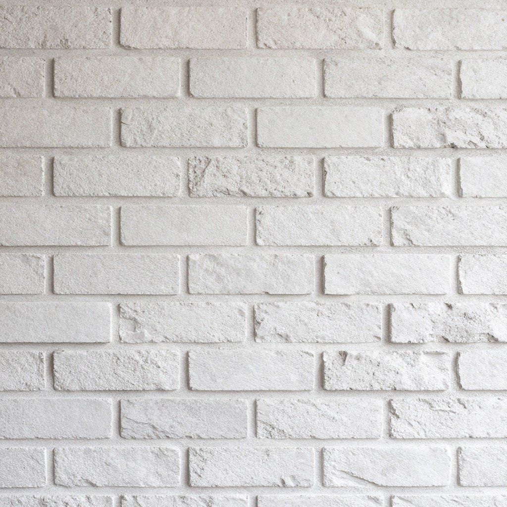 Faux brick wallpaper in whitewashed finish
