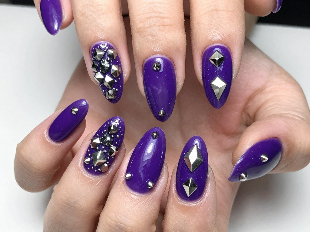 Purple nails with metallic silver stud embellishments