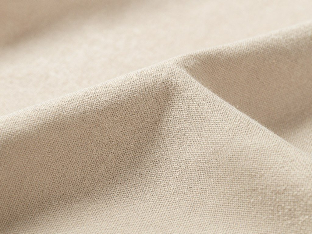 beige linen curtain fabric showing natural texture and warm tone