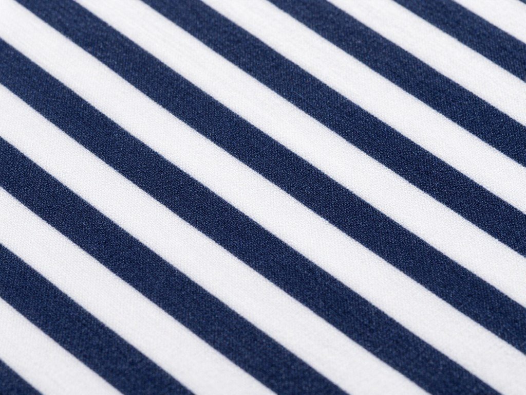 close-up of navy and white striped curtain fabric showing pattern detail
