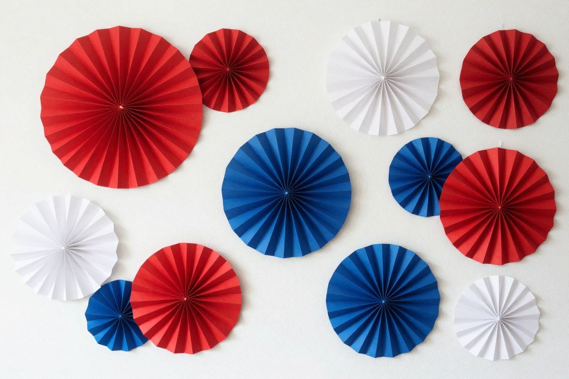 decorative paper fans in patriotic colors mounted on wall backdrop