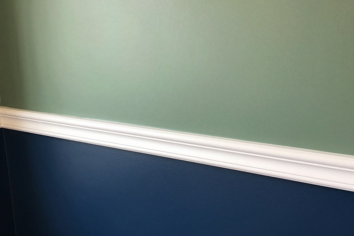 detail of two-tone wall with chair rail trim