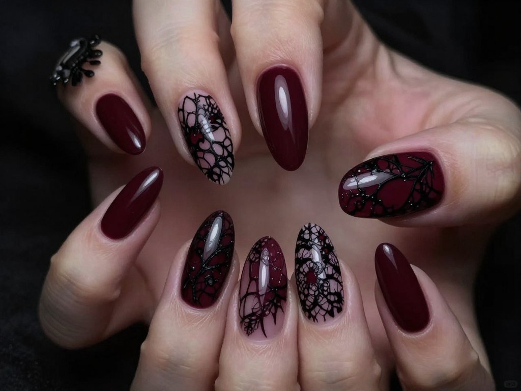 Edgy short summer nails in burgundy with black lace pattern overlay